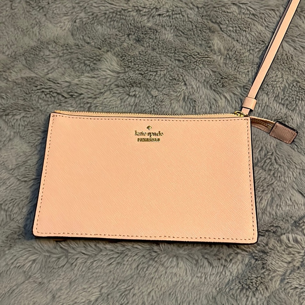 Pink Kate Spade wristlet.